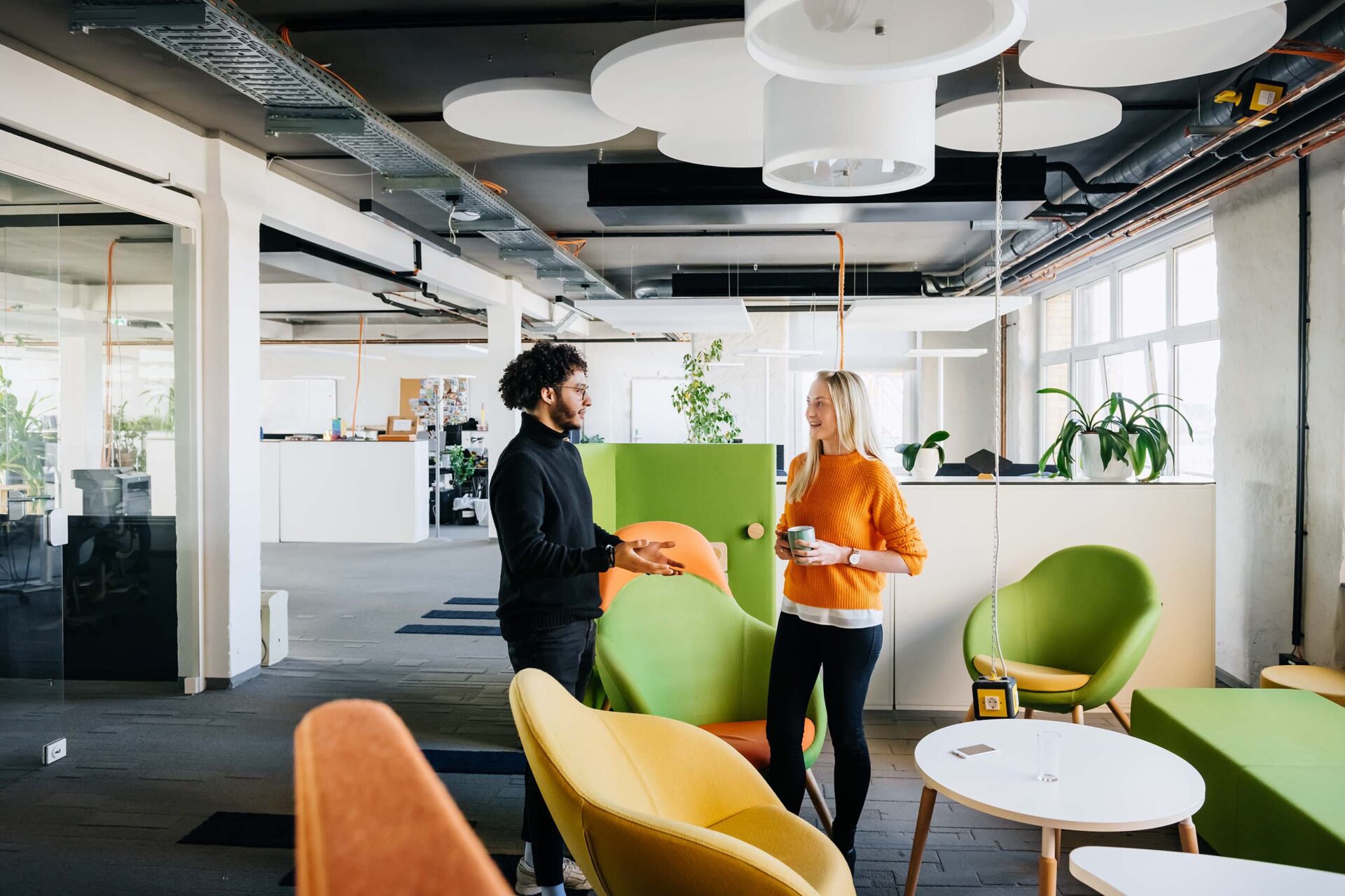 Two people talking in the office